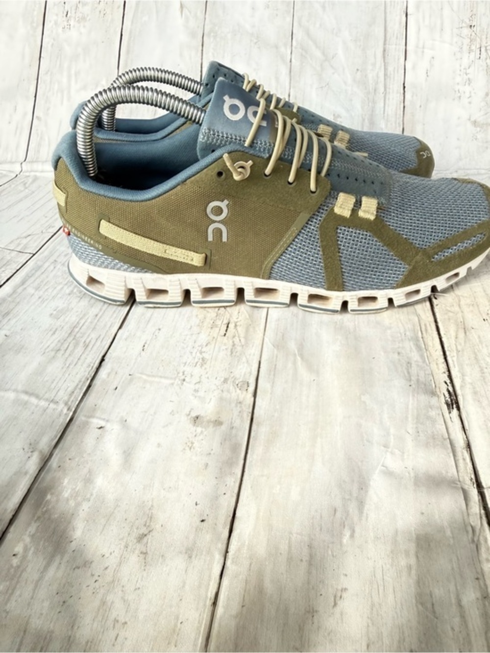 On Running Cloud sneakers feature a blue and olive